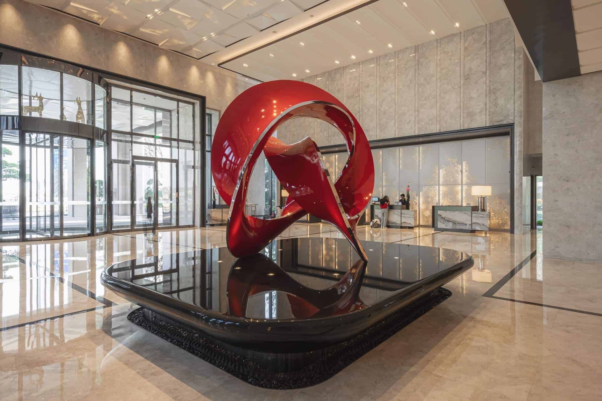 large abstrract sculpture in red