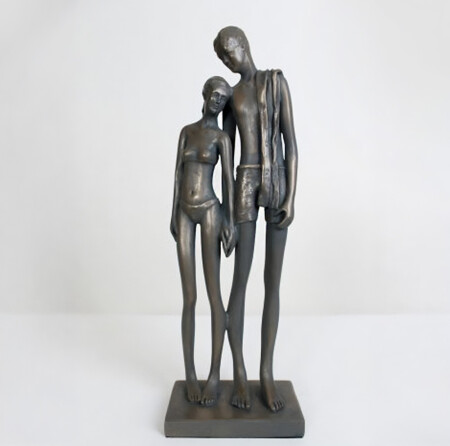 bronze surfer swimming sculpture