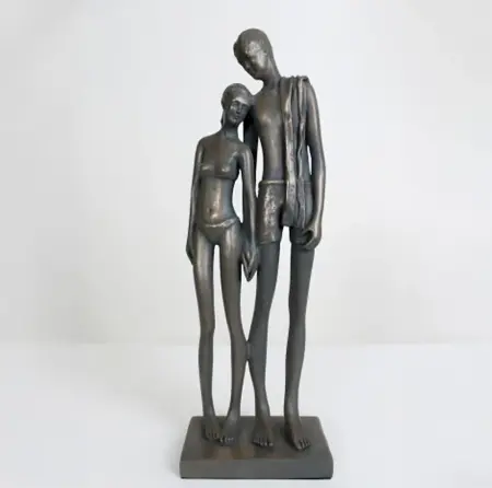 bronze surfer swimming sculpture