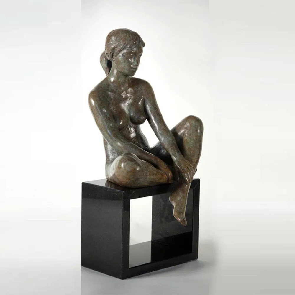 Phillip Piperides Sitting Nude bronze sculpture on a stone plinth, SOHO Galleries Sydney